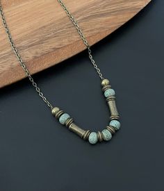 Beautiful handmade boho antique bronze gold necklace with ceramic turquoise beads. Available in 14 - 40 inch chain lengths  Please feel free to visit our other store for a large range of beautiful boho earrings. www.etsy.com/shop/Indigoofcheshire Thank you for your interest Bohemian Gold Necklace With Patina, Bohemian Metal Necklaces With Patina, Bohemian Brass Necklace With Patina, Bohemian Adjustable Patina Necklace, Turquoise Brass Necklaces For Jewelry Making, Bohemian Bronze Necklace With Oxidized Finish, Antique Gold Bohemian Necklace Nickel Free, Bohemian Antique Gold Necklace With Antique Finish, Bohemian Antique Gold Nickel-free Necklace