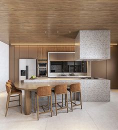 a modern kitchen with an island and bar stools