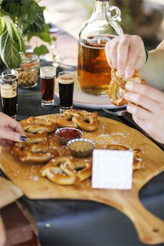 people are eating pretzels and drinking beer