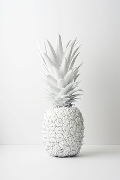 a white pineapple sitting on top of a table