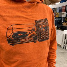 Browse the stacks in style and comfort. Screen printed in Black ink on Autumn Orange French Terry cotton/poly* pullover hoodie. Thumb hole cuffs! The hem of this hoodie hits just below the waist, so we recommend sizing up if you have a long torso or like a longer fit. Unisex size XS-XXL available. Specs and size chart in photos. *70%/30% Casual Hooded Hoodie With Screen Print, Retro Cotton Hoodie With Graphic Print, Urban Printed Hoodie For Fall, Casual Hooded Sweatshirt With Screen Print, Casual Winter Hoodie With Screen Print, Retro Relaxed Fit Hoodie For Fall, Retro Cotton Hoodie With Drawstring Hood, Casual Fall Hoodie With Screen Print, Relaxed Fit Screen Printed Hoodie For Fall