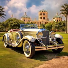 an antique car parked on the grass in front of a large building with palm trees