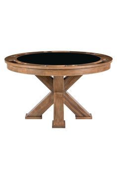 a round wooden table with black glass top