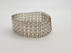 Vintage Milor Italian 925 Silver Ricchio Bracelet  Item w#1383 Clean and in good condition 7.5 inches long with a box style clasp and a single side safety latch 25 mm wide 39.8 grams Welcome to Westgate Jewels!! We specialize in vintage estate, designer, and fine jewelry. Our shop consists of items that are estate, antique, and / or vintage conditions unless otherwise noted. This means that most items are prior owned and may have some imperfections such as light scratches, scuffs, and / or patin Sterling Silver Bracelets For Formal Occasions, Formal White Gold Bracelets With Box Clasp, Formal White Gold Bracelet With Box Clasp, Formal Sterling Silver Bracelets With Box Clasp, Luxury Silver Bracelets With Box Clasp, Formal Sterling Silver Bracelet With Box Clasp, Hallmarked Sterling Silver Bracelet For Formal Occasions, Formal Silver Chain Bracelet With Sterling Silver Clasp, Formal Sterling Silver Jubilee Bangle