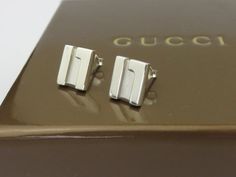 Brand: Gucci Material: 925 Sterling Silver Size: Width 9 mm, Height 11 mm Hallmarks: Gucci / Made in Italy / 925 Stunning G logo earrings made by Gucci. Good condition. The posts are slightly bent, the original backs are missing. The replacements are new silver no brand ones. Gucci box included. A great gift for your loved one. The earrings are hallmarked and guaranteed 100% authentic. The earrings have been authenticated by a professional before sale. 100% money back guarantee on authenticity. The Replacements, Gucci Box, G Logo, Jewelry Earrings Studs, Favorite Jewelry, Etsy Earrings, Great Gifts, In Italy, Accessory Gift