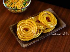 some food is sitting on a wooden tray