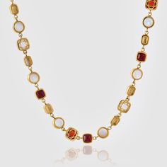 Length: 19.5"Stone Size: 5-10mm The Red Crystal Gemstone Necklace features a striking contrast of real pearl alongside red and yellow crystal. Set within secure bezel settings, each premium-cut gem boasts beveled edges that not only enrich its natural color but also ensure enduring durability. Yet, it's the larger, oval-cut mother-of-pearl and 18K Gold clovers that truly command attention. Designed for a perfect neckline fit, this piece features unique coupled links and is finished with our sign Red Multi-stone Necklaces As Gifts, Red Multi-stone Necklace For Gift, Luxury Red Cabochon Necklaces, Luxury Red Cabochon Necklace, Elegant Red Natural Gemstones, Ice Necklace, Pearl Shop, Real Pearls, Pearl Gemstone