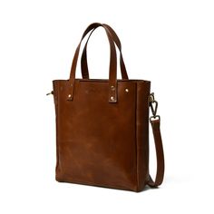 Introducing Executive Elegance- The Sleek Brown Leather Women's Office Shoulder Bag. With a spacious central compartment, it easily accommodates your laptop, files, and more. Inside, a small zippered pocket adds organizational convenience. The adjustable strap allows comfortable shoulder wear, while sturdy handles offer a handbag option. Crafted from premium buffalo hide and artisanally handcrafted, this bag is a blend of sophistication and functionality for the modern professional woman. Salien Leather Briefcase With Laptop Sleeve, Classic Laptop Bag With Zipper Closure For Work, Leather Laptop Bag With Zipper Pocket For Office, Classic Everyday Laptop Bag With Sleeve, Classic Laptop Bag With Sleeve For Everyday Use, Formal Laptop Bag With Laptop Sleeve, Classic Brown Laptop Bag With Zipper Pocket, Formal Satchel Briefcase With Zipper Pocket, Classic Bags With Laptop Sleeve For Everyday Use