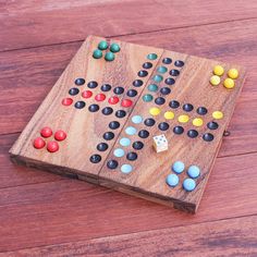 a wooden board game sitting on top of a wooden floor