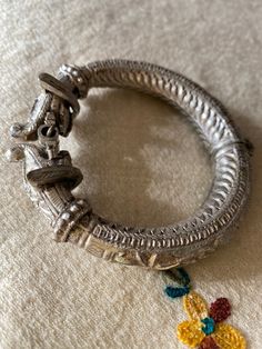 This lovely hinged makara bracelet is very detailed in its design. It is probably north Indian and certainly antique, possibly late 19th or early 20thC. Made of low grade hollow silver it has complex repousee work and line etching. Although a lovely collectors item, it is in fact very wearable as it is not overly chunky and sits snugly, yet dramatically, on the wrist! Line Etching, Jewelry Lookbook, Hinges, Cuff Bracelets, Jewelry Bracelets, Etsy Accessories, Bangles, Accessory Gift, Cuff