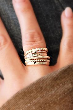 GORGEOUS stacking name rings set, including personalized name rings and dainty gold stacking rings. This gold filled set is a great gift for mom or grandma! Discover our beautiful kids name ring stacks, the perfect sentimental gift for mom's birthday or moms-to-be! These stackable kids name rings pair perfectly with their birthstone rings & are the perfect simple meaningful jewelry pieces to add to your collection. Shop all of our custom personalized jewelry and gold name rings here! Stackable 14k Gold Rings For Valentine's Day, Dainty Stackable Heart Ring Gift, Valentine's Day Stackable Sterling Silver Rings, Valentine's Day Rose Gold Sterling Silver Stackable Rings, Stackable Heart-shaped Open Ring As Gift, Sterling Silver Stackable Initial Ring, Mother's Day 14k Gold Stackable Rings, Stackable Open Heart Ring As Gift, Stackable Heart Ring With Round Band For Gift