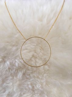 "Handmade necklace consisting of a large single circle strung from a delicate chain. The chain shown is 18\", but custom lengths are welcomed. Available in silver and gold. This unique necklace is perfect for anyone loves accessorizing with on trend, modern or minimalist jewelry. Made from high quality 16k gold plated brass. It has an effortless chic vibe to it and is great for layering. All jewelry is lovingly made in Massachusetts and ships profesionally packaged in an attractive box, ready to Simple Necklace With Delicate Chain For Layering, Simple Delicate Chain Necklace For Layering, Layering Jewelry With Cable Chain, Minimalist 14k Gold Cable Chain Necklace, Minimalist Delicate Chain Necklaces For Layering, Minimalist Layered Long Necklace With Clavicle Chain, Simple Everyday Necklace With Delicate Chain, Minimalist Cable Chain Jewelry, Dainty Round Chain Necklace With Adjustable Chain