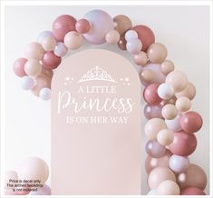 a little princess is on her way sign surrounded by pink and white balloons in the shape of a wreath