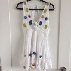 Anthropologie Piper By Townsen Dress Size Xs. Condition Nwt. Color White. Measurements 32" Length (Measured Flat From Shoulder To Bottom Of Dress) 15" Bust (Measured Flat From Underarm To Underarm) 13" Waist (Measured Flat At Waist) 20" Hips (Measured Flat At Hip). Zipper At Back Below Waist. Button At Top Back. 100%Cotton V-neck Cotton Dress With Tie Back, Cotton V-neck Dress With Tie Back, Beach Mini Dress With Floral Embroidery And V-neck, V-neck Mini Dress With Floral Embroidery For Beach, White V-neck Sundress, Floral Embroidered V-neck Mini Dress For Beach, V-neck Floral Embroidery Mini Dress For Beach, Bohemian Sleeveless Mini Dress For Daytime, White Cotton V-neck Mini Dress