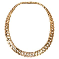 Exquisite C de Cartier yellow gold choker necklace with diamonds. The center five links have 45 diamonds. The necklace is 9/16" wide and 17 3/4" in wearable length. It is made in France and in as new condition. It is sold in the original Cartier presentation case. Cartier Diamond, Necklace With Diamonds, Diamond Choker Necklace, Diamond Choker, Gold Choker Necklace, Gold Choker, Matching Bracelets, Elegant Style, Cartier