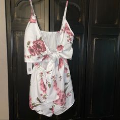 Nwt, Light Weight, Adjustable Straps, Tie Front, Opening At That Peeps Tummy, Elastic Around Waist White With Pinkish Purplish Flowers White Floral Print Casual Sets, Casual White Floral Print Sets, White Casual Floral Print Sets, White Printed Vacation Sets, White Cotton Jumpsuits And Rompers For Vacation, White Cotton V-neck Jumpsuits And Rompers, White Cotton V-neck Jumpsuit, White Printed Sets For Day Out, White Floral Print Beach Set