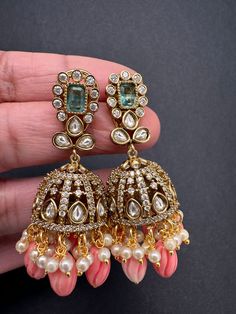 Moissanite AD Tulip Beads Jhumkas pushback earringsColor : VictorianSize : Length : 2 Inches; Weight : 10 grams eachStones : AD Stones Pearls Tulip Beads Ad Earrings Design, Traditional Jhumkas, Tulip Beads, Ad Earrings, Desi Jewelry, Classic Jewelry Pieces, Jhumka Designs, Ear Chain, Jhumki Earrings