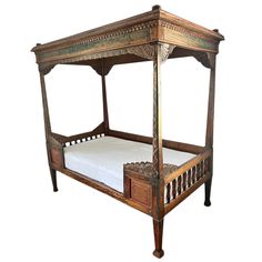 an old wooden bed with white sheets and pillows on it's sides, against a white background