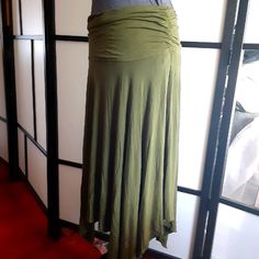 Olive Green Reaction Kenneth Cole Handkercheif Skirt. Never Worn, In Great Condition Like New. Its Very Soft And Light Making It Very Comfortable. It Has An Elastic Waistband To Hold It Up On Your Waist And The Sides Have A Constricted Stitch Design On The Sides. Top Sold Separately But Can Be Bundled, See Separate Listing For Item Details. Casual Stretch Skirt With Asymmetrical Hem, Casual Asymmetrical Hem Stretch Skirt, Fitted Casual Draped Skirt, Casual Long Draped Skirt, Casual Long Flowy Draped Skirt, Green Ruched Stretch Skirt, Green Fitted Asymmetrical Draped Skirt, Green Non-stretch Maxi Skirt, Kenneth Cole Reaction