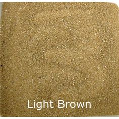 the sand is brown and has white writing that says light brown on it's side