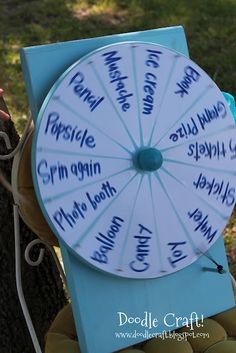 a wheel of fortune sitting on top of a tree