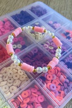 a plastic container filled with lots of different colored beads