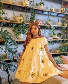 This beautiful short Habesha Kemis is a true masterpiece, with an elegant Tilf design that adds a touch of sophistication and tradition to the overall look. The intricate Tilf embroidery is present on the neckline, sleeves, and hemline, creating a mesmerizing pattern that is both intricate and modern. The Kemis is made of luxurious Fetil material, which drapes beautifully on the body, creating a flattering silhouette. The Fetil material is soft and lightweight, making it perfect for a short dres Traditional Tunic Dress With Floral Embroidery, Festive Bohemian Dress With Embroidered Sleeves, Festive Traditional Dress With Embroidered Hem, Festive Traditional Embroidered Dress With Hem Detail, Traditional Embroidered Dress With Embroidered Hem, Traditional Spring Dress With Embroidered Neckline, Festive Tunic Dress With Embroidered Neckline, Traditional Dresses With Embroidered Sleeves For Festive Season, Bohemian Short Sleeve Dresses For Festive Occasions