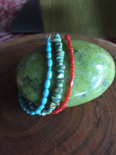 This set of 3 bracelets is perfect for stacking or you can wear each one separately or with other bracelets. One is strung with blue turquoise, another with green turquoise chips and the third is red Mediterranean coral. All have small .925 Sterling Silver lobster clasps. Each one is 7.5 inches long. Turquoise Multi-strand Wrap Bracelet As Gift, Turquoise Multi-strand Hand Wrapped Bracelets, Turquoise Multi-strand Hand Wrapped Jewelry, Bohemian Single Strand Beaded Bracelets As Gift, Turquoise Multi-strand Gemstone Beads Bracelets, Turquoise Stackable Bracelets As Gift, Stackable Turquoise Wrap Bracelet, Red Bohemian Stackable Bracelets, Turquoise Single Strand Bracelet Gift