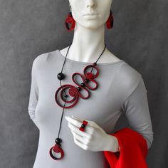 "Bohemian spiral black necklace with red accent, Statement bold necklace, Contemporary necklace, Unusual necklace. Bib necklace or set... Beautiful playful spiral necklace. Long, elegant, rich in shapes. Black necklace with red accent. Gorgeous stylish bohemian necklace. Eye catching artistic jewelry. Necklace is soft and light, very comfortable to wear. Dimensions: - Necklace length: 23\" / 59cm (around neck). - Earrings length: 2\"/ 5cm; Total drop length: 2.8\"/ 7cm. - Ring size by order Opti Red Spiral Jewelry As Gift, Red Spiral Jewelry For Gifts, Spiral Shaped Red Jewelry For Gifts, Adjustable Red Spiral Jewelry, Elegant Black Spiral Jewelry, Modern Red Necklace For Party, Black Party Jewelry With Unique Variations, Modern Red Adjustable Necklace, Spiral Black Necklace As A Gift