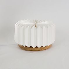 a small white object sitting on top of a table