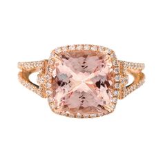 18 Karat Rose Gold 4.05 Carat Cushion-Cut Pink Morganite and Diamond Cluster Ring This impressive peachy pink morganite and diamond ring is alluring. The solitaire cushion cut morganite in eagle prong-setting is accentuated with the single row of grain set round diamonds in solid rose gold. The diamond cluster exemplifies the focus back on the morgainte, as the leveled down diamonds flash through the light drawing everyone’s eyes to the ring. The double gaped-row merged band with pave set round Light Drawing, Cushion Cut Solitaire, Morganite Diamond, Pink Morganite, Diamond Cluster Ring, Peachy Pink, Diamond Cluster, Cluster Ring, Morganite