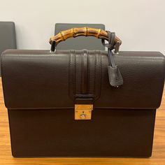 Used Once In Pristine Condition Like New Leather Briefcase And Suede Inside Bamboo Handle Rare And Very Hard To Find I Have Matching Bamboo Suede Mens Loafers If You Are Interested In Buying The Set Classic Gucci Bag With Bamboo Handle, Brown Gucci Bag With Bamboo Handle, Formal Brown Gucci Bag, Luxury Brown Briefcase With Gold-tone Hardware, Formal Brown Briefcase With Gold-tone Hardware, Timeless Gucci Business Bags, Gucci High-end Formal Bags, Formal Brown Bag With Bamboo Handle, High-end Gucci Bags For Formal Occasions