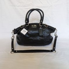 Listed Is Coach Sophia Black Leather, Two-Way Satchel Nwt. Model Number 18609 With Measurements Approximately 13"(L), 9"(H), 3.5"(D). Features Include: *Two-Way Satchel: Leather Attached Handle And Detachable Shoulder Strap *Top Zipper Closure *Purple Satin Fabric Interior *Logo Hanging Key Chain *Silver Tone Hardware Note: Satchel Comes With Factory Defect On Inside Pocket Zipper. Zipper Handle Is Not Attached To Zipper. See Photos For Details! For Questions, Please Don't Hesitate To Ask! I Jus Sequin Handbag, Sophia Black, Interior Logo, Black Satchel, Black Leather Satchel, Leather Satchel Handbags, Leather Saddle Bags, Leather Satchel Bag, Purple Satin