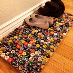 a pair of shoes sitting on top of a mat covered in bottle caps