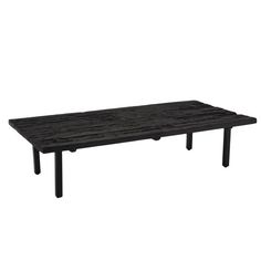 a black table sitting on top of a white floor