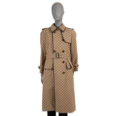 100% authentic Gucci trench coat in beige GG jacquard canvas cotton (71%) and polyester (29%). Features dark brown leather trims, spread collar, storm flap on the front and back, flap pockets, epaulettes, belted cuffs, belt loops and a matching belt with pin buckle. Closes with a double row of buttons and is lined in orange logo satin viscose (100%). Has been worn and is in excellent condition. Measurements Tag Size 38 Size XS Shoulder Width 46cm (17.9in) Bust From 106cm (41.3in) Waist From 118cm (46in) Hips From 138cm (53.8in) Length 109cm (42.5in) Side Seam Length 87cm (33.9in) Sleeve Length 56cm (21.8in) All our listings include only the listed item unless otherwise specified in the description above Gucci Luxury Blazer, Gucci Trench Coat, Orange Logo, Gucci Monogram, Dark Brown Leather, Leather Coat, Leather Trims, Cognac, Blazer Jacket