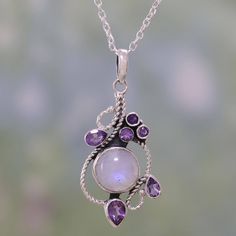 A round rainbow moonstone is accompanied by over one carat of petite amethysts in this necklace. From Shanker, the pendant is crafted by hand, framing the stones with graceful sterling silver rope motifs. Amethyst Pendant Necklace, Amethyst Necklace Pendant, Magical Jewelry, 판타지 아트, Fancy Jewelry, Amethyst Necklace, Sterling Silver Necklace Pendants, Amethyst Pendant, Fantasy Jewelry