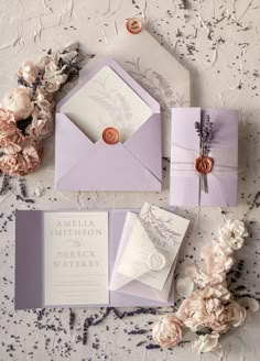 the wedding stationery is laid out and ready to be put into their guests'envelopes