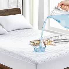 someone is pouring water into their bed