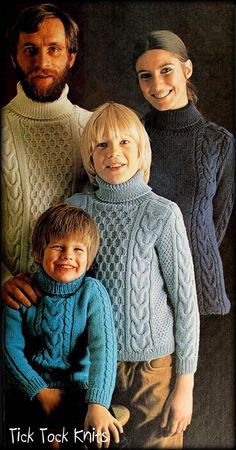 an older man and two young children wearing sweaters