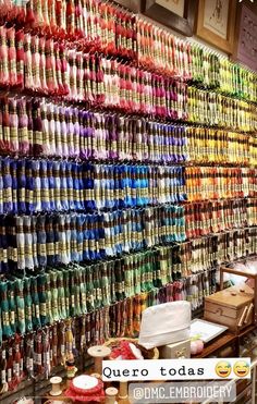 there are many different items on display in this store that is filled with colorful ribbons