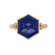 Like a starry night sky this step cut Hexagon Lapis is set in 14k yellow gold with gold bead accents and a sterling silver nestle band. Approx stone size: 12mm x 12mm Approx ct weight: 5.6cts This mixed metal piece is handmade to order in Emily's Hudson Valley studio. Please allow for slight variations in stone color, size and shape. Please allow 14-21 days to ship unless the piece is in stock. If you have questions about sizing or shipping or custom orders please reach out to us! Gold Octagon Sterling Silver Ring, Gold Sterling Silver Octagon Rings, Hexagon Ring, Lapis Ring, Starry Night Sky, Step Cut, Local Jewelry, Sterling Silver Bands, Hudson Valley