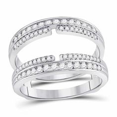 two white gold rings with diamonds on each band and one diamond set in the middle