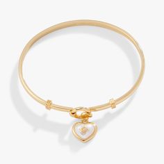 a gold bracelet with a heart charm on the end and a small diamond in the middle