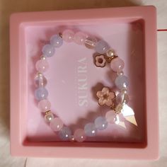 Nwot Dainty Stretch Bracelet By Sakura. Pink And Bluish Main Beads. Has Pink Flower Charms. Great For Gifting . Sakura Accessories, Beads Charm, Cardcaptor Sakura, Flower Charm, Pink Flower, Stretch Bracelet, Stretch Bracelets, Bracelet Making, Bead Charms