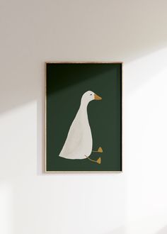 a white duck sitting on top of a green wall next to a wooden shelf and lamp