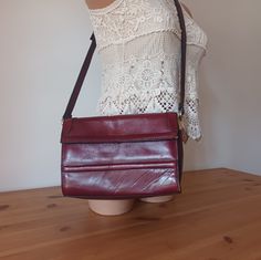 Nice Vintage Women  Burgundy Leather Flap Bag/Cross Body Bag/Shoulder Bag. Retro style. Solid Print. Material: genuine leather. 3 pockets. Burgundy color. Measurements: height: 17.5 cm (6.89") width: 9.5 cm (3.74") length: 25 cm (9.84") Strap length: adjustable. Very good vintage condition with some signs of use. See the photos. Vintage Women, Retro Stil, Burgundy Color, Flap Bag, Bag Shoulder, Style Retro, Body Bag, Leather Crossbody Bag, Cross Body Handbags