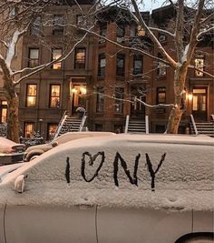 a car covered in snow with the word tony written on it