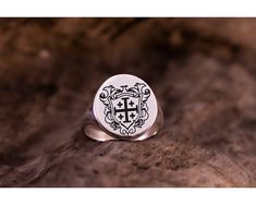 Embrace the sacred significance of faith with our Jerusalem Cross Ring, a reverent symbol of Christianity and spiritual devotion. Paired with our Christian Eastern Orthodox Cross Signet Ring for Women and Religious Pinky Ring for Men, this collection honors the rich heritage of the Orthodox tradition. Crafted with meticulous detail and inspired by centuries of religious artistry, each piece in our Baptism Jewelry Gift collection is a testament to the enduring power of faith. Whether it's a gift for her or him, our rings symbolize strength, grace, and the eternal promise of divine love. Celebrate the sanctity of baptism and spiritual renewal with our Jerusalem Cross Ring set. Give the gift of faith and let your loved ones carry the spirit of devotion with them on their journey of faith. - M Engraved White Gold Spiritual Signet Ring, Engraved White Gold Signet Ring With Spiritual Style, Classic Silver Jewelry For Baptism, Silver Classic Jewelry For Baptism, Silver Engraved Ring With Coat Of Arms, Round Jewelry With Coat Of Arms For Gifts, Spiritual Engraved Jewelry For Baptism, Engraved Spiritual Jewelry For Baptism, Engraved Ring With Coat Of Arms As A Gift