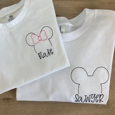 This short sleeve white tee is made of 100% organic cotton (I use Honest baby clothing brand) and comes embroidered with your little one's name. Choose either a mickey or Minnie outline. This design is also available on a infant size bodysuit. Please wash on delicate cycle in cold water, and dry normally. If you are wanting a different design, more wording, or a different clothing style, please send me a message so we can discuss the details. If you need this order rushed, please add these to yo Cute White T-shirt With Custom Embroidery, White Cute T-shirt With Custom Embroidery, Customizable Cute White T-shirt, White Basic T-shirt With Custom Embroidery, Basic White Embroidered T-shirt, Minnie Outline, Diy Disney Ears, Honest Baby Products, Baby Mickey Mouse